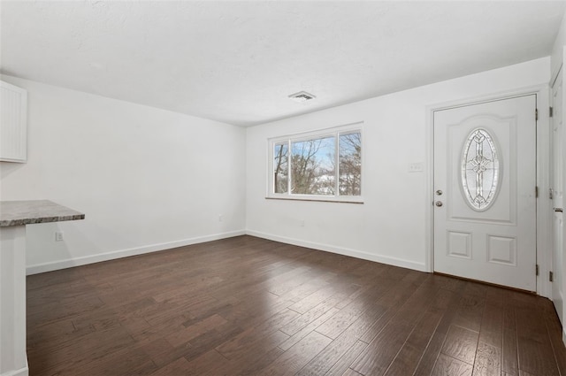 foyer with dark wood-type flooring