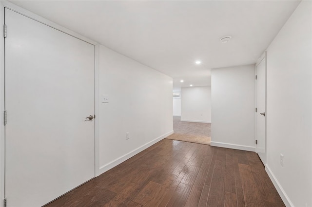 spare room with dark hardwood / wood-style flooring