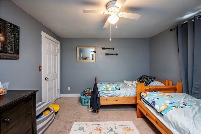 bedroom featuring ceiling fan and light colored carpet