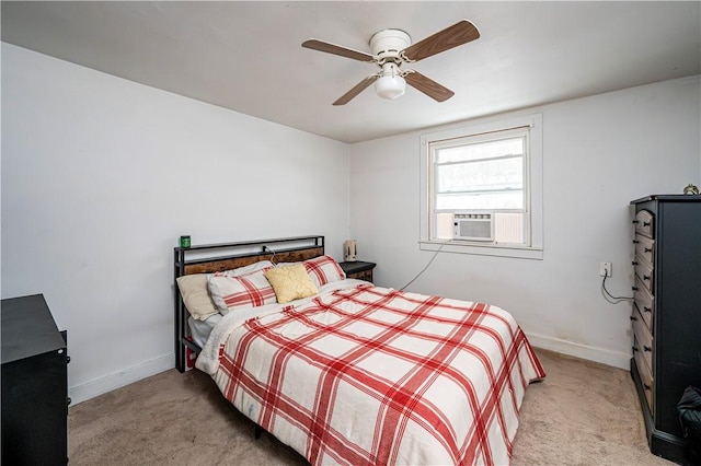 bedroom with light colored carpet, ceiling fan, and cooling unit