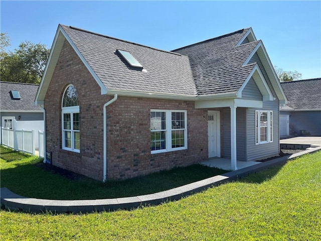 view of home's exterior with a yard