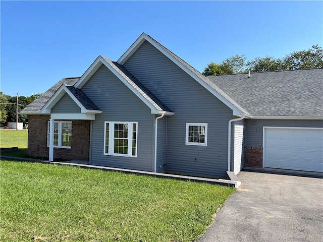 ranch-style home with a garage and a front yard