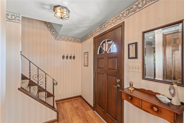 foyer entrance with light hardwood / wood-style floors