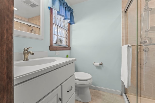 bathroom featuring tile patterned floors, an enclosed shower, vanity, and toilet