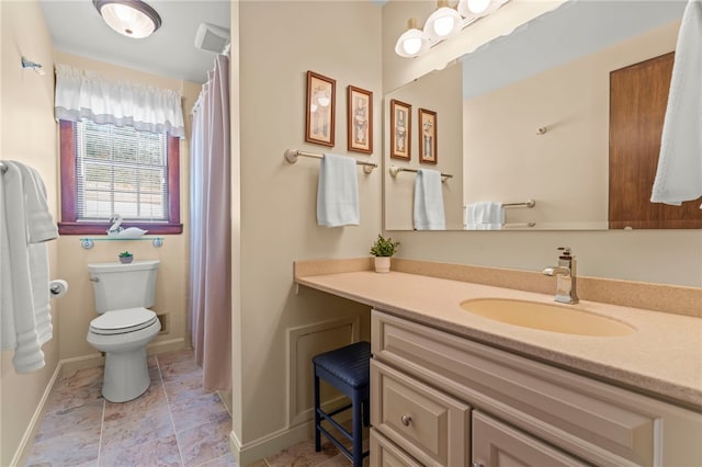 bathroom with toilet and vanity