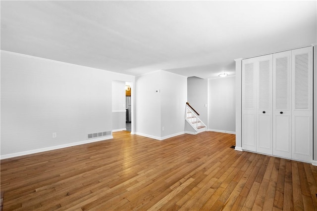 unfurnished living room with light hardwood / wood-style floors