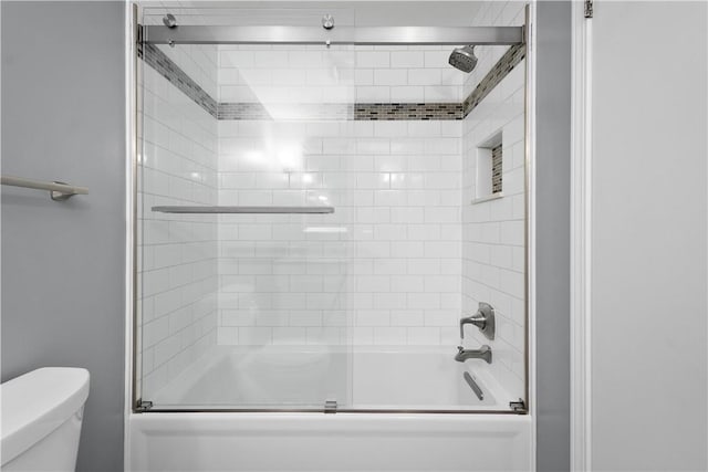 bathroom with toilet and enclosed tub / shower combo