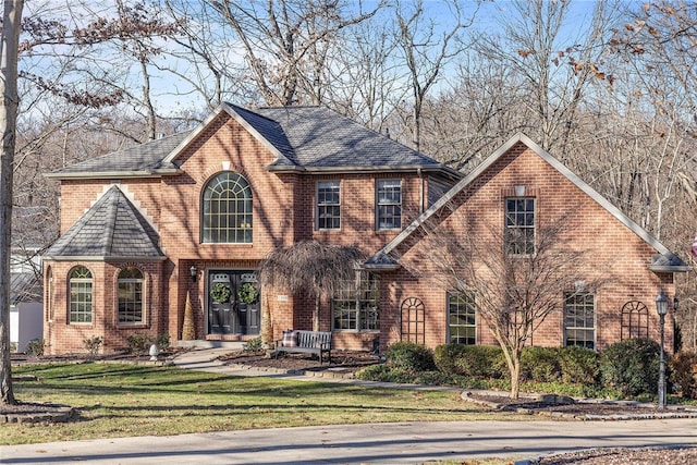 view of front of property with french doors and a front yard