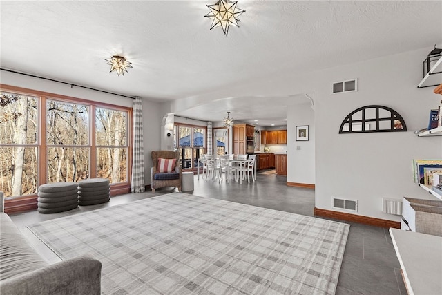 living room with a textured ceiling