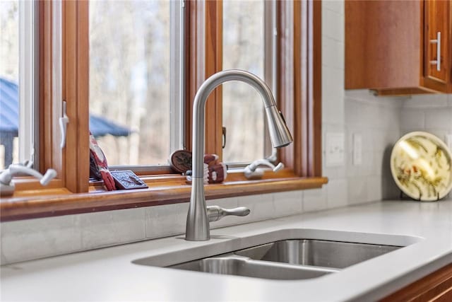 details with decorative backsplash and sink