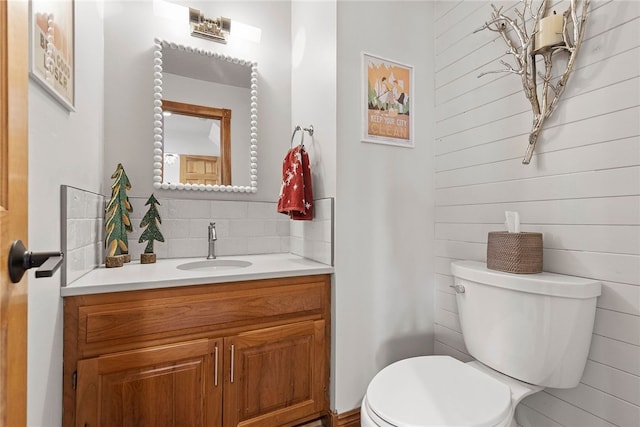 bathroom with toilet and vanity