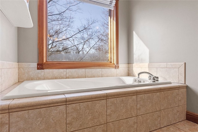 bathroom featuring a relaxing tiled tub