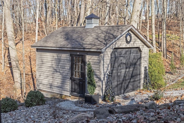 view of outbuilding with a garage