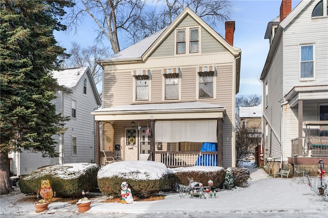 view of front of property featuring covered porch