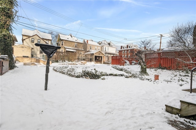 view of yard covered in snow