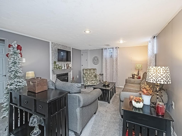 carpeted living room featuring a large fireplace and ornamental molding