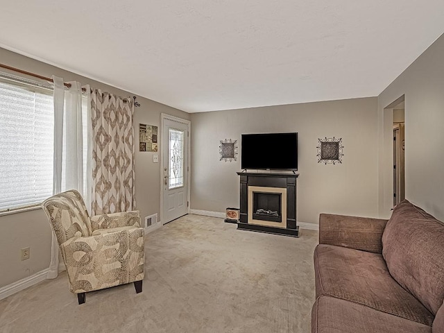 living room with light colored carpet and a wealth of natural light