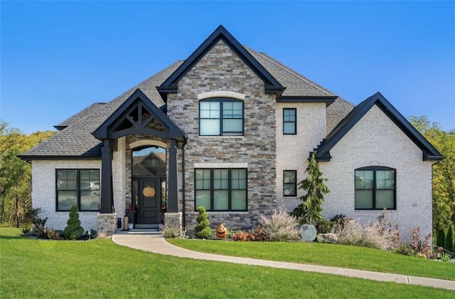 french country home featuring a front lawn