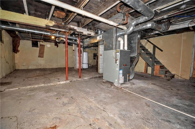 basement featuring heating unit and gas water heater