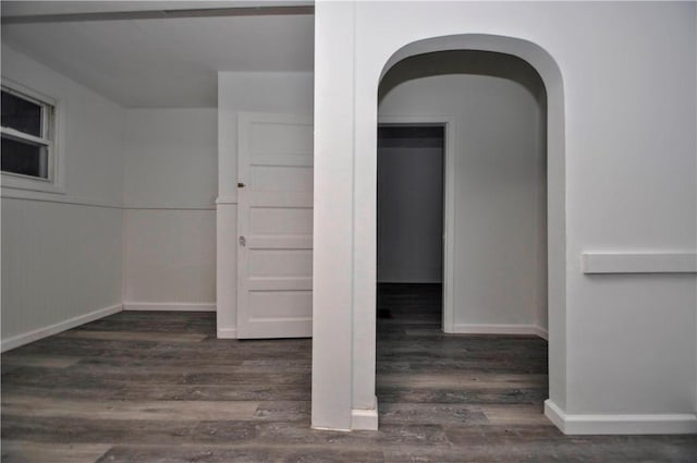 empty room featuring dark wood-type flooring