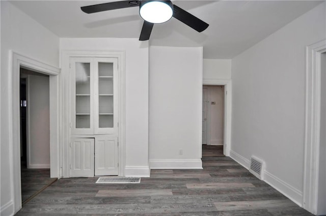 interior space featuring dark hardwood / wood-style flooring and ceiling fan