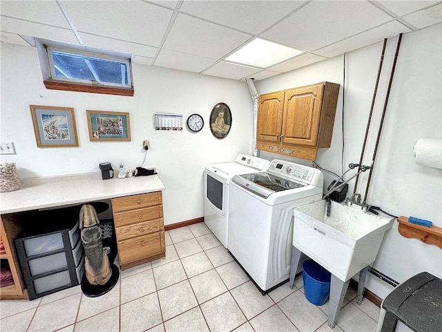 washroom featuring cabinets, separate washer and dryer, and light tile patterned flooring