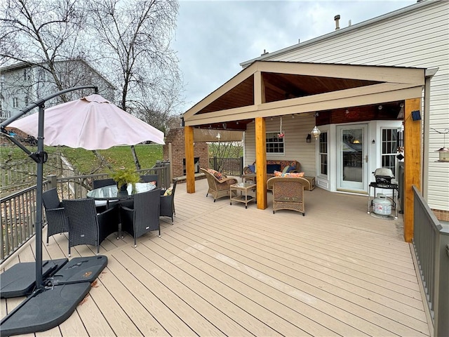 wooden deck with an outdoor living space