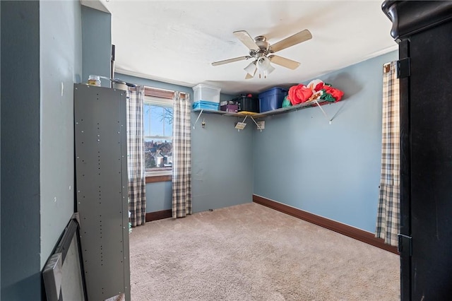 unfurnished bedroom featuring ceiling fan and carpet