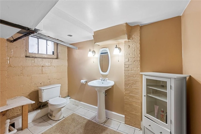 bathroom featuring toilet and tile patterned floors