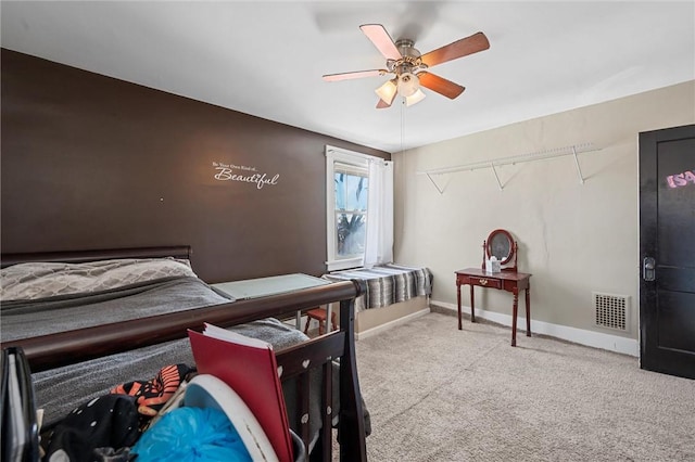 bedroom with ceiling fan and light colored carpet