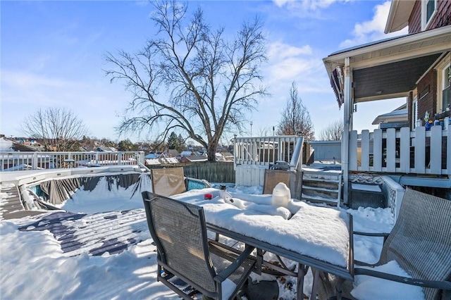 view of snow covered deck