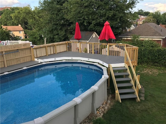 view of pool with a wooden deck