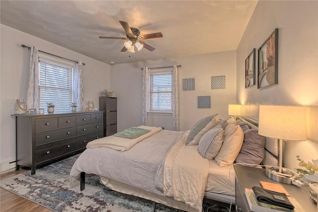 bedroom featuring ceiling fan and hardwood / wood-style flooring