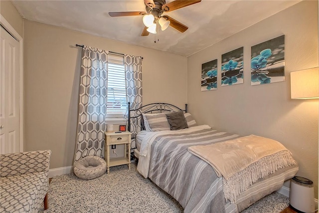 bedroom featuring ceiling fan and a closet