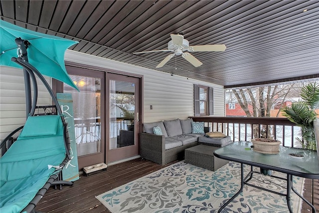 sunroom / solarium featuring ceiling fan and a wealth of natural light