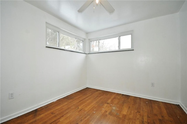 unfurnished room with hardwood / wood-style flooring and ceiling fan