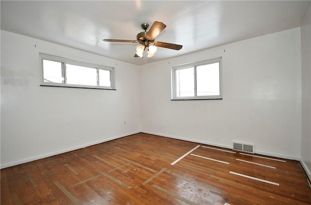 empty room featuring hardwood / wood-style flooring and ceiling fan