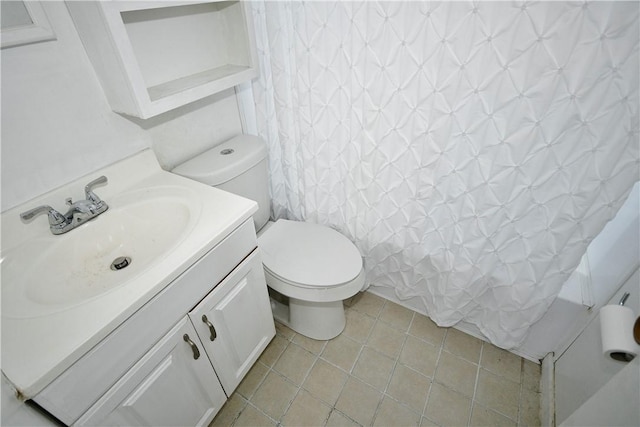 full bathroom featuring shower / bath combination with curtain, tile patterned floors, vanity, and toilet