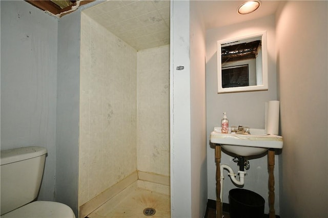 bathroom featuring walk in shower and toilet