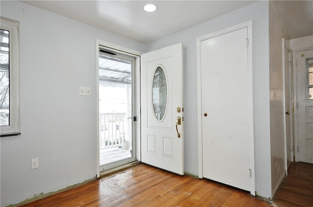 foyer entrance with light hardwood / wood-style flooring