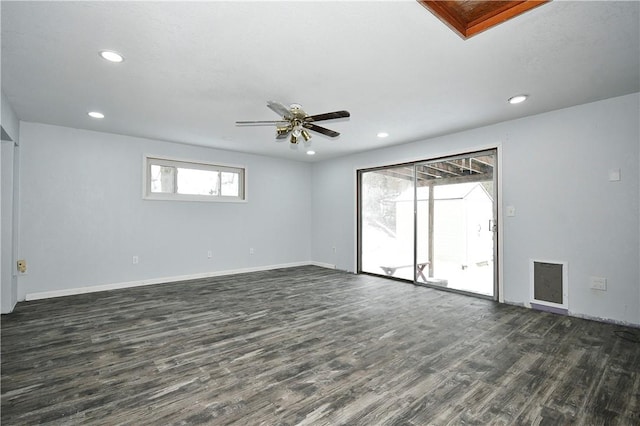 spare room with ceiling fan, dark hardwood / wood-style floors, and plenty of natural light