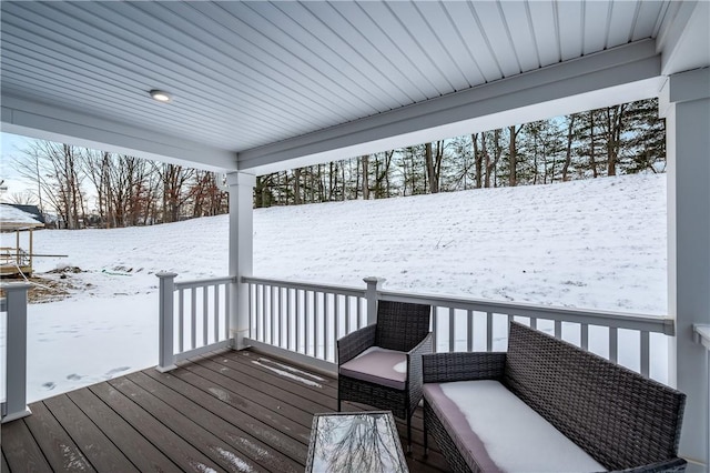 view of snow covered deck