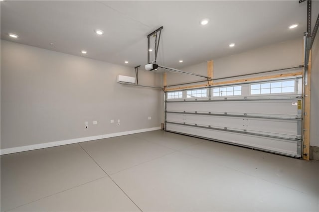 garage with a wall mounted air conditioner and a garage door opener