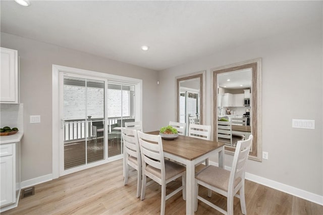 dining room featuring light hardwood / wood-style flooring