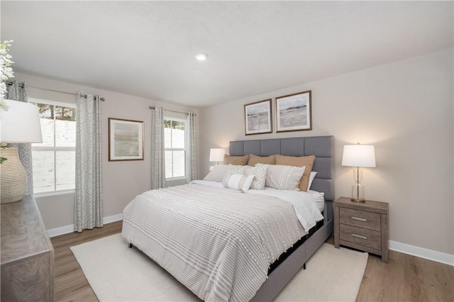 bedroom with hardwood / wood-style floors