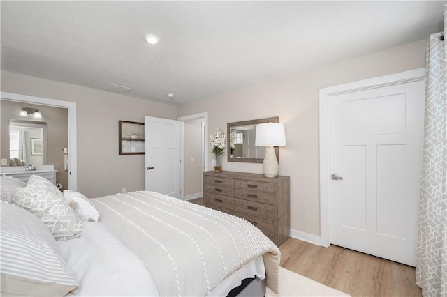 bedroom featuring light hardwood / wood-style flooring