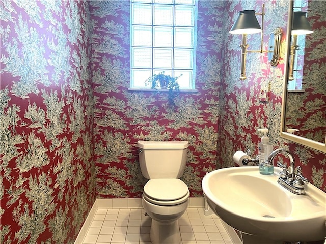 bathroom with sink, tile patterned floors, and toilet