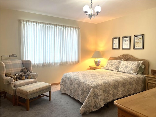 carpeted bedroom with an inviting chandelier