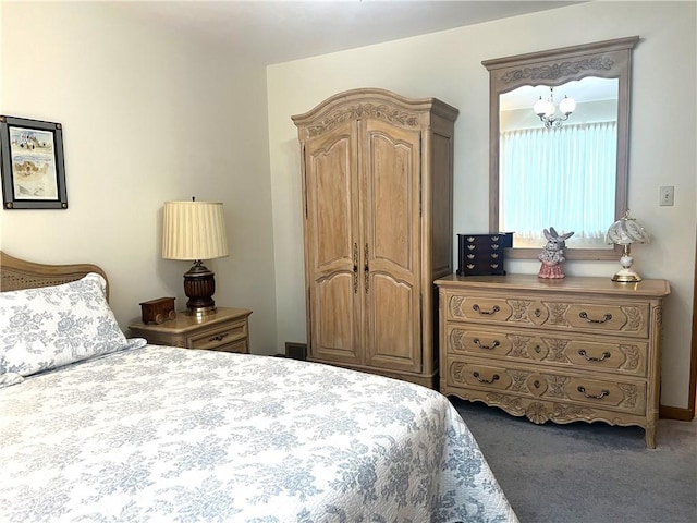 carpeted bedroom with a chandelier