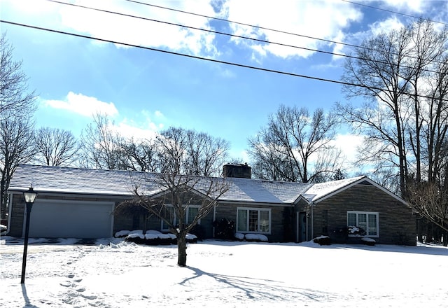 single story home with a garage